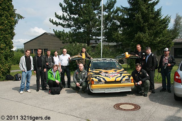 Participants in front of Tiger DeLorean